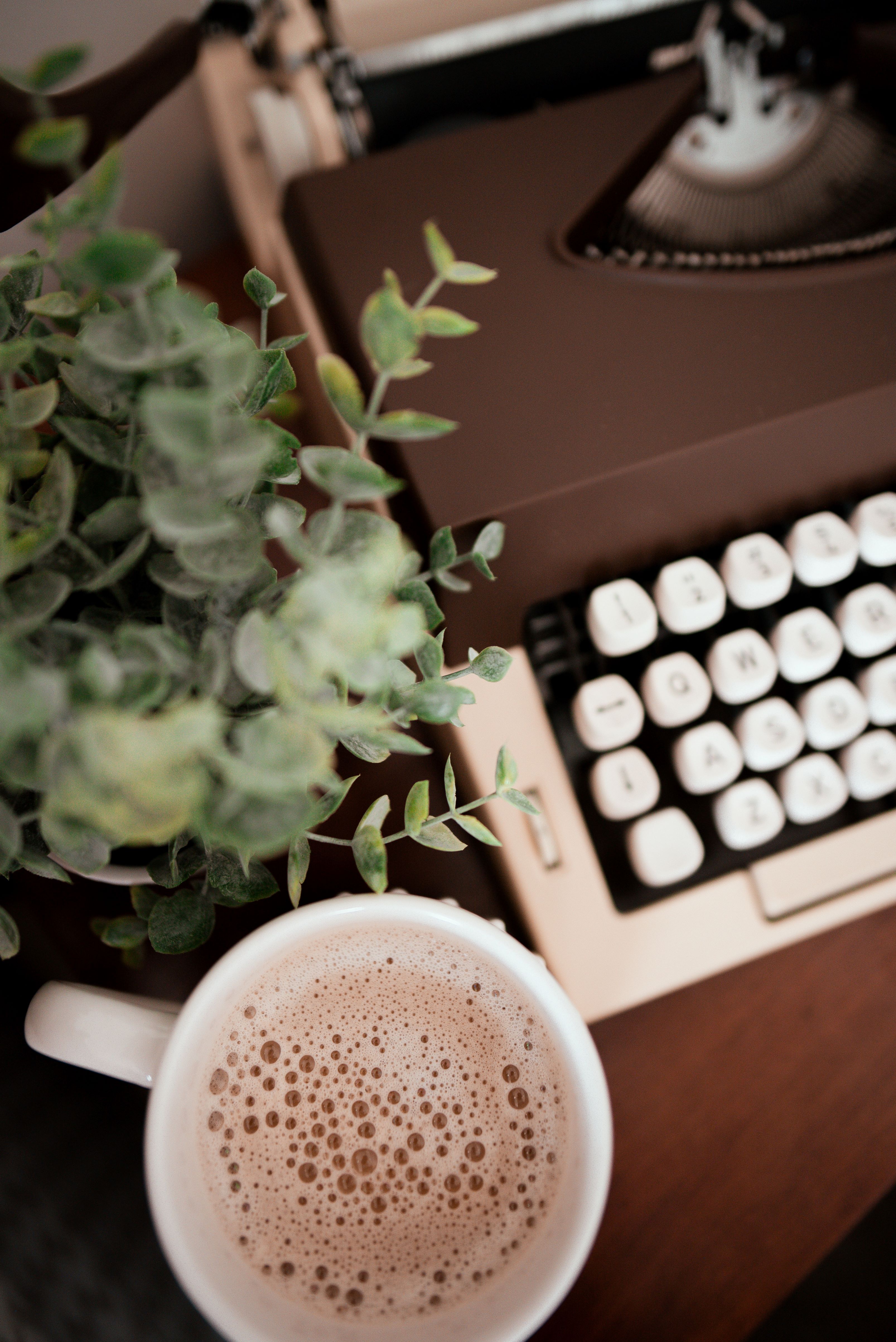 A typewriter and a cup of coffee
